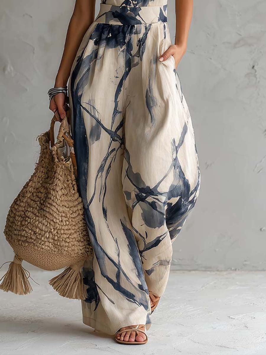 Tuta con scollo halterneck, stampa effetto lavaggio inchiostro, gamba ampia, con tasche
