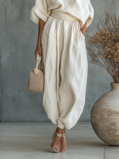 Set in lino avorio da donna con top a spalle scoperte e pantaloni a gamba affusolata • S1