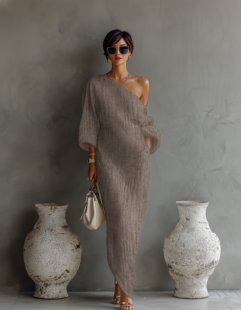 Vestito elegante e fluido in bianco avorio con spalle scoperte