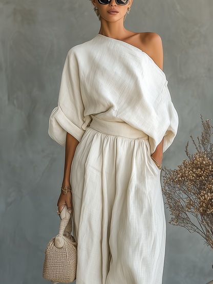 Set in lino avorio da donna con top a spalle scoperte e pantaloni a gamba affusolata • S1